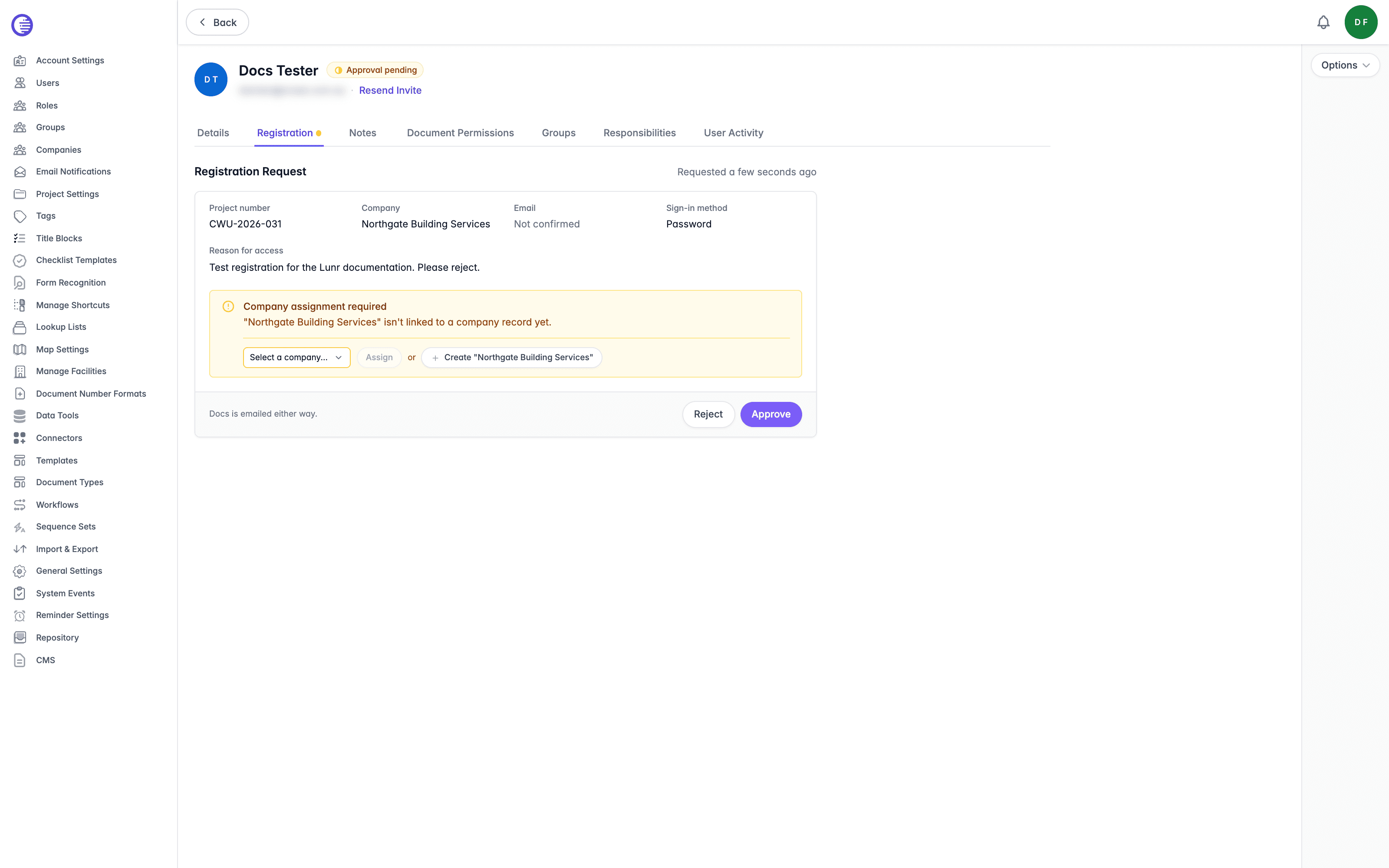 Registration tab for a pending user, showing the project number, company, unconfirmed email, sign-in method, and reason for access, the Company assignment required section, and the Reject and Approve buttons